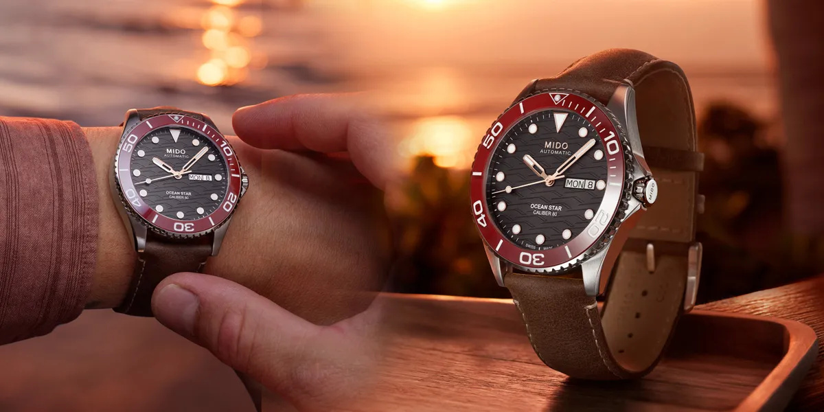 Mido Ocean Star 200C นิยามความงามแห่งท้องฟ้ายามอาทิตย์อัสดง นาฬิกา Mido Ocean Star 200C หน้าปัดสีดำลายคลื่น ขอบเซรามิกสีแดง สายหนังสีน้ำตาล"