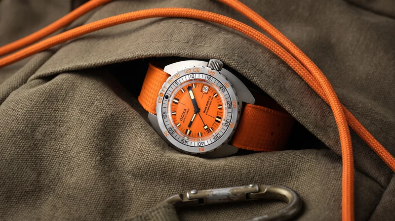 Doxa SUB300Ti5 ขยายทางเลือกสู่ตัวเรือนไทเทเนียม เกรด 5 นาฬิกาดำน้ำ Doxa SUB300Ti5 ตัวเรือนไทเทเนียม เกรด 5 หน้าปัดสีส้ม Professional สายยาง Dive Flex